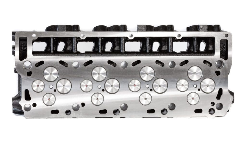 Machined cylinder head surface with valve seats
